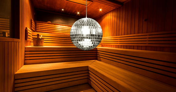 A disco ball hangs in a sauna.